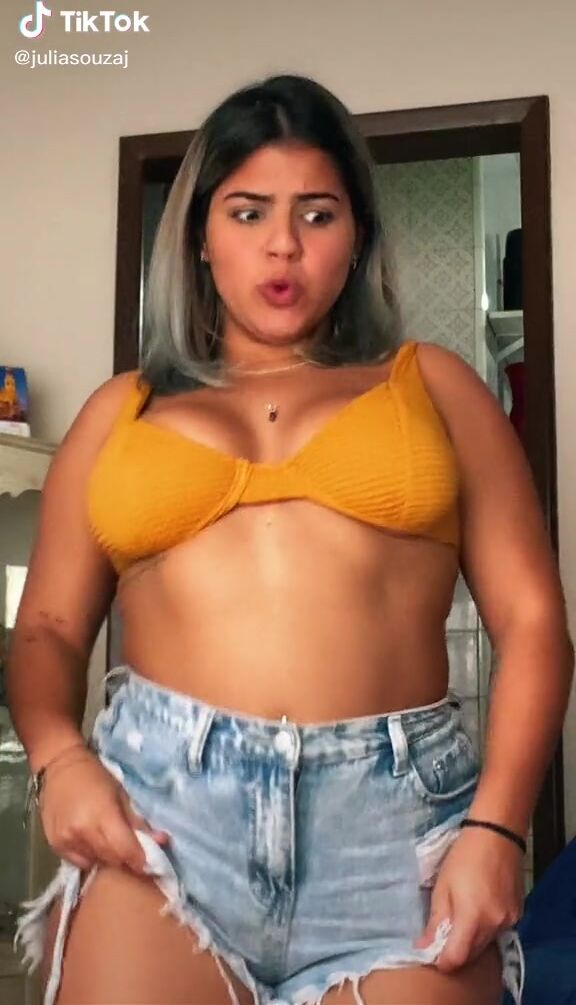 Sexy Julia Antunes Shows Cleavage And Bouncing Boobs In Yellow Bikini