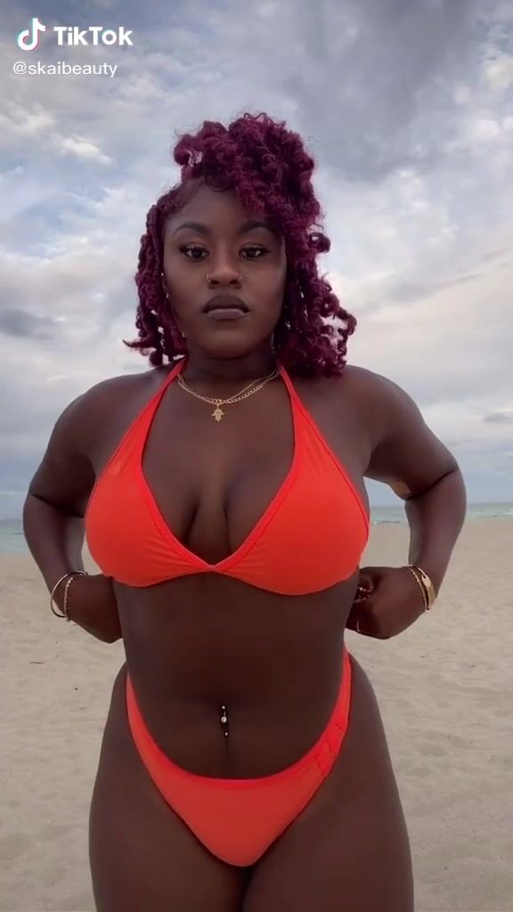 Elegant Skaibeauty Shows Cleavage In Electric Orange Bikini At The