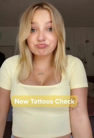 Really Cute Alina Mour Shows Cleavage in Yellow Crop Top