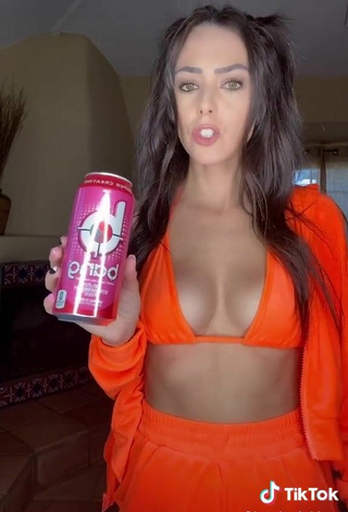 3. Sexy Brooke Bridges Shows Cleavage in Orange Bikini Top