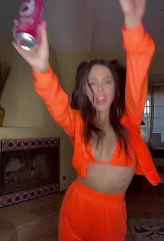 5. Sexy Brooke Bridges Shows Cleavage in Orange Bikini Top