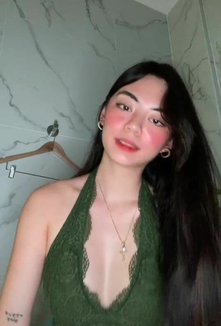 Cute Camille Trinidad Shows Cleavage in Olive Crop Top