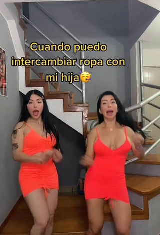 2. Sexy Adriana Espitia Shows Cleavage in Electric Orange Dress