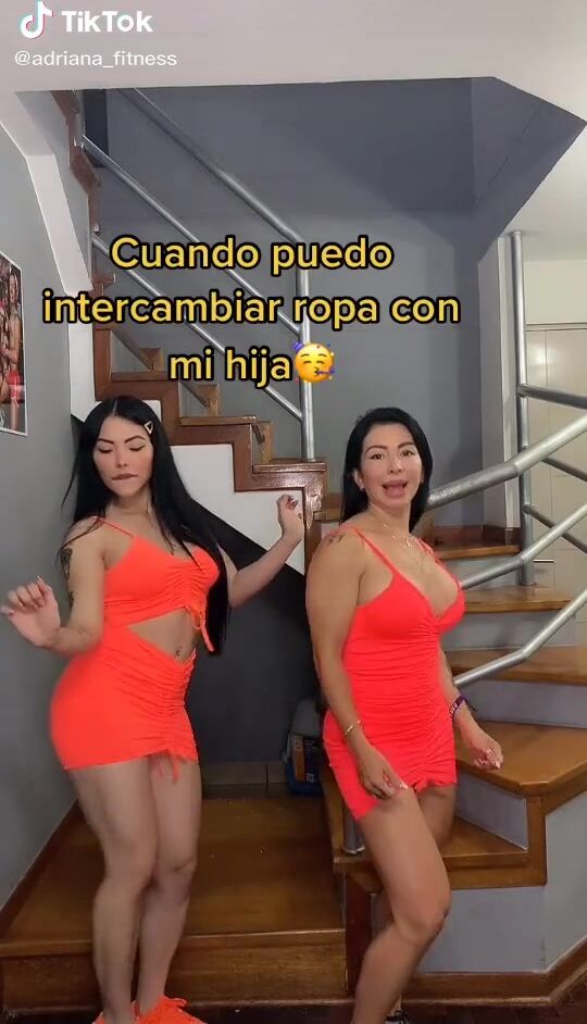 Sexy Adriana Espitia Shows Cleavage in Electric Orange Dress