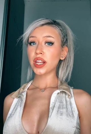 4. Cute Alexis Feather Shows Cleavage in Silver Crop Top