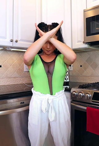 3. Sexy Ashley Nocera Shows Cleavage in Green Bodysuit