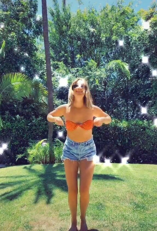 3. Cute Ashley Tisdale in Orange Bikini Top