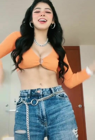 Beautiful Aylin Criss Shows Cleavage in Sexy Orange Crop Top