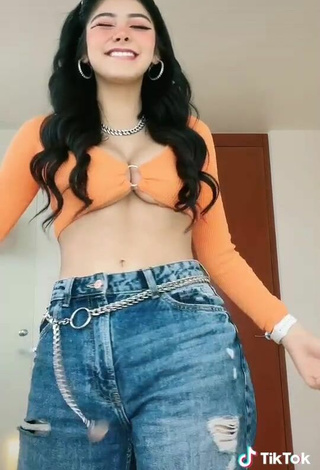 3. Beautiful Aylin Criss Shows Cleavage in Sexy Orange Crop Top