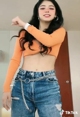 5. Beautiful Aylin Criss Shows Cleavage in Sexy Orange Crop Top