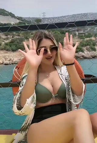 2. Hot Eda Aslankoç Shows Cleavage in Olive Bikini on a Boat