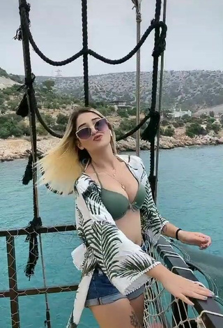 2. Sweetie Eda Aslankoç Shows Cleavage in Olive Bikini Top on a Boat
