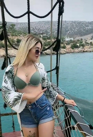 3. Sweetie Eda Aslankoç Shows Cleavage in Olive Bikini Top on a Boat