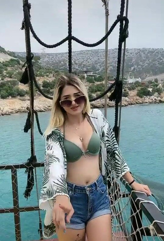 4. Sweetie Eda Aslankoç Shows Cleavage in Olive Bikini Top on a Boat