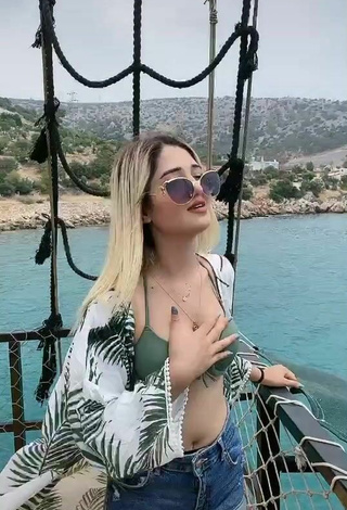 5. Sweetie Eda Aslankoç Shows Cleavage in Olive Bikini Top on a Boat