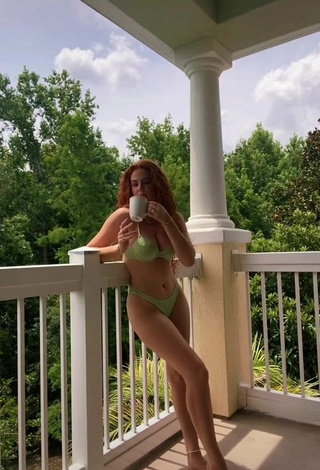 Sexy Faith Collins in Green Bikini on the Balcony