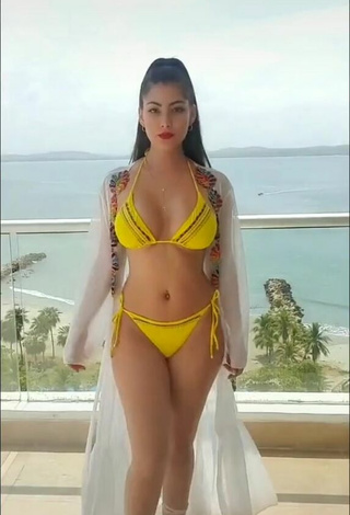 Sensual Franjomar Shows Cleavage in Yellow Bikini on the Balcony