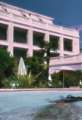 1. Cute Iris Ferrari in White Bikini at the Swimming Pool