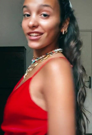 2. Sexy Iris Ferrari Shows Cleavage in Red Dress