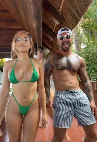 Hot Maddy Belle Shows Cleavage in Green Mini Bikini