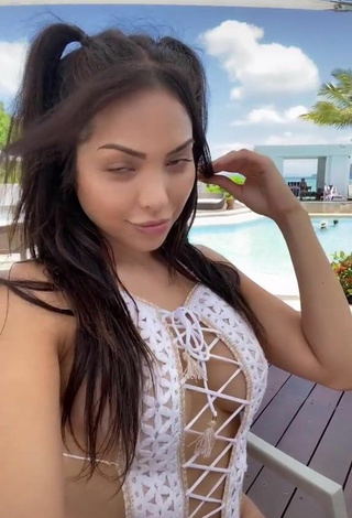 2. Cute Maddy Belle Shows Cleavage in White Swimsuit at the Pool