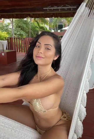 Sweet Maddy Belle Shows Cleavage in Cute Golden Bikini