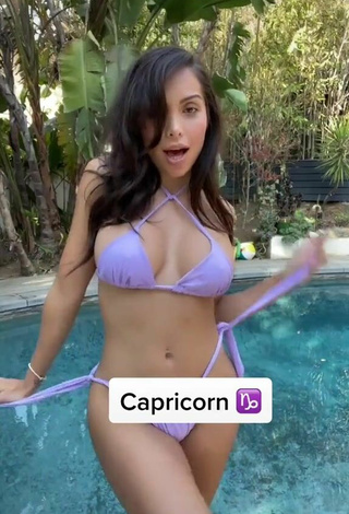 2. Amazing Maddy Belle Shows Cleavage in Hot Purple Bikini at the Pool