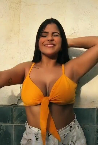 4. Attractive Julia Antunes Shows Cleavage in Yellow Crop Top