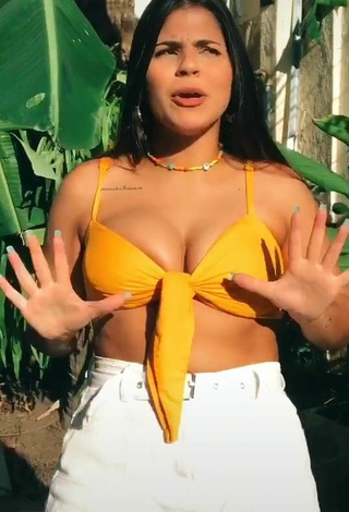 2. Julia Antunes Looks Sexy in Yellow Bikini Top