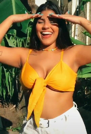 5. Julia Antunes Looks Sexy in Yellow Bikini Top