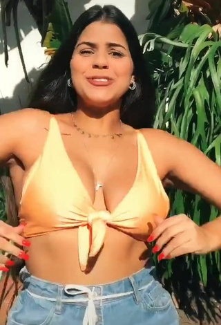 2. Julia Antunes Shows Cleavage in Inviting Yellow Bikini Top