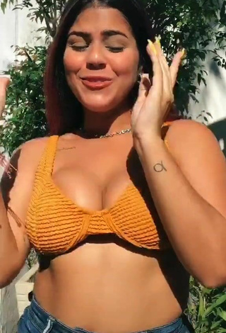 3. Julia Antunes Shows Cleavage in Sweet Orange Bikini Top