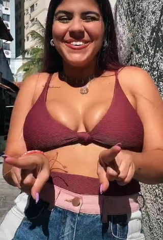 Magnetic Julia Antunes Shows Cleavage in Appealing Red Bikini Top