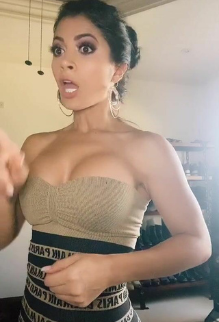 Erotic Kimberly Flores Shows Cleavage in Dress
