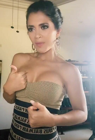 2. Erotic Kimberly Flores Shows Cleavage in Dress