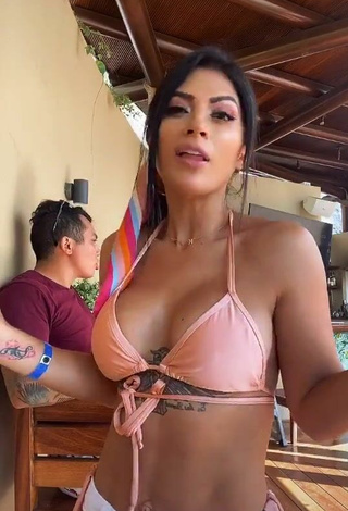 2. Cute Kimberly Flores Shows Cleavage in Peach Bikini Top