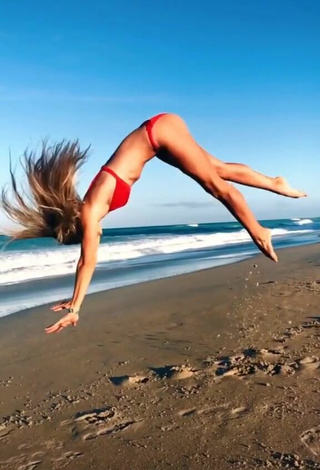 3. Adorable Olivia Dunne in Seductive Red Bikini at the Beach while doing Fitness Exercises