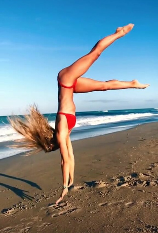 4. Adorable Olivia Dunne in Seductive Red Bikini at the Beach while doing Fitness Exercises