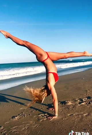 5. Adorable Olivia Dunne in Seductive Red Bikini at the Beach while doing Fitness Exercises