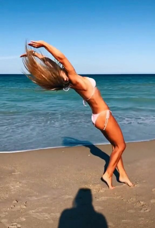3. Lovely Olivia Dunne in White Bikini at the Beach while doing Fitness Exercises