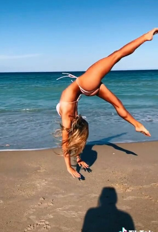 5. Lovely Olivia Dunne in White Bikini at the Beach while doing Fitness Exercises