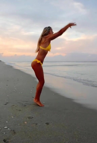 3. Really Cute Olivia Dunne in Yellow Bikini at the Beach while doing Fitness Exercises