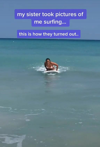 2. Breathtaking Olivia Dunne in White Bikini in the Sea at the Beach