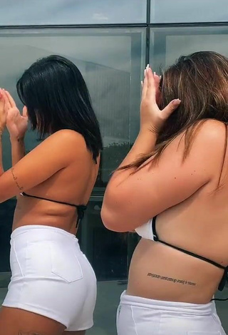 3. Beautiful MC Lya Shows Cleavage in Sexy White Bikini Top