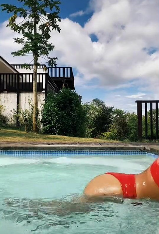 1. Sexy Melissa Santos Shows Cleavage in Red Bikini at the Swimming Pool