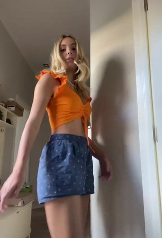 4. Hot Alex French Shows Cleavage in Orange Crop Top