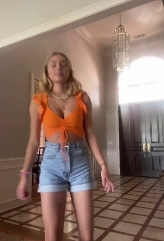 Sexy Alex French Shows Cleavage in Orange Crop Top