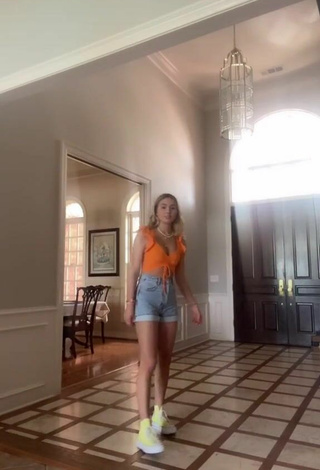 2. Sexy Alex French Shows Cleavage in Orange Crop Top