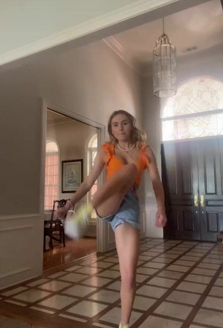5. Sexy Alex French Shows Cleavage in Orange Crop Top
