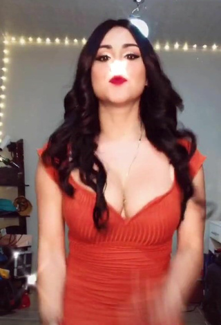 3. Cute Ónice Flores Shows Cleavage in Orange Dress and Bouncing Boobs